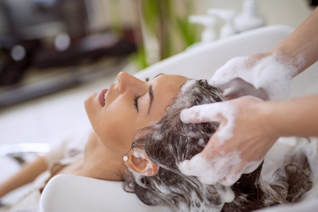 woman having her hair rinsed