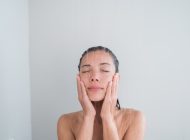 a woman using a body scrub