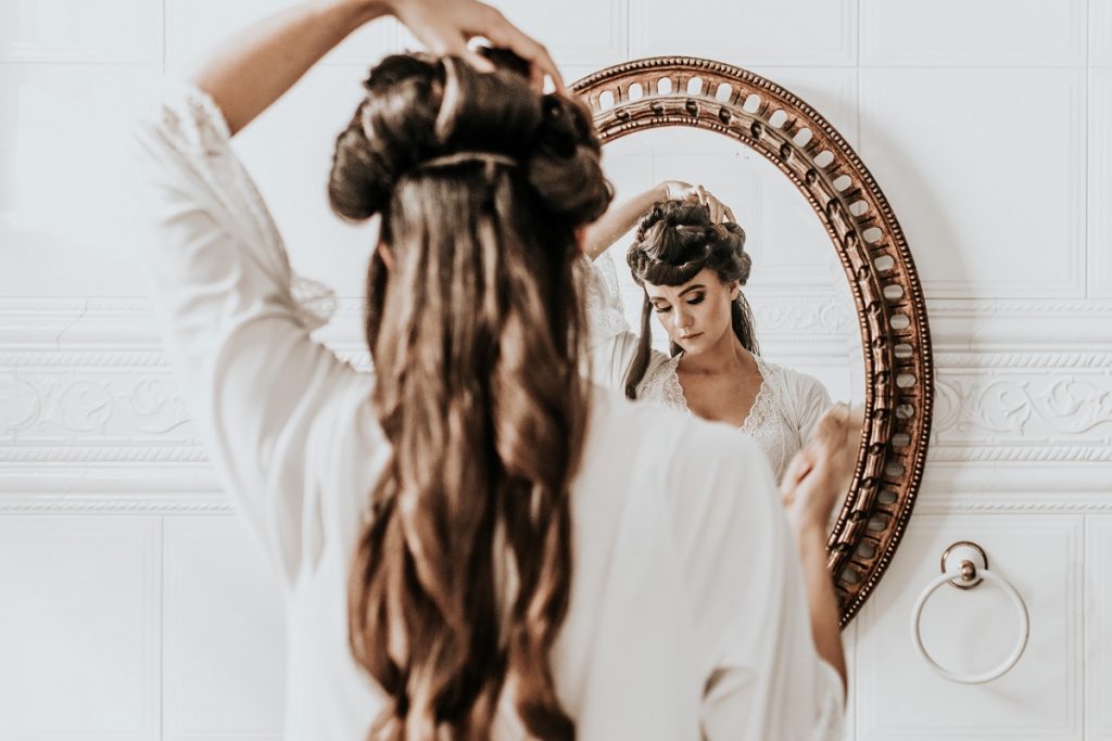 woman fixing her hair